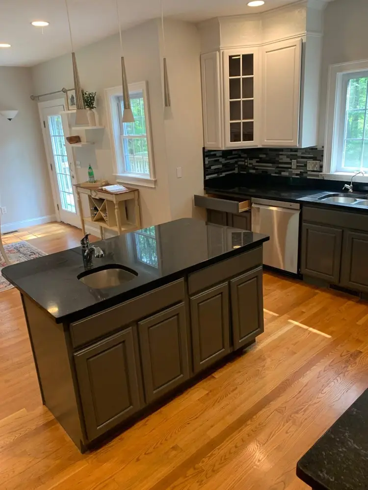 Renovated modern kitchen with new cabinets and countertops in a Greater Boston home